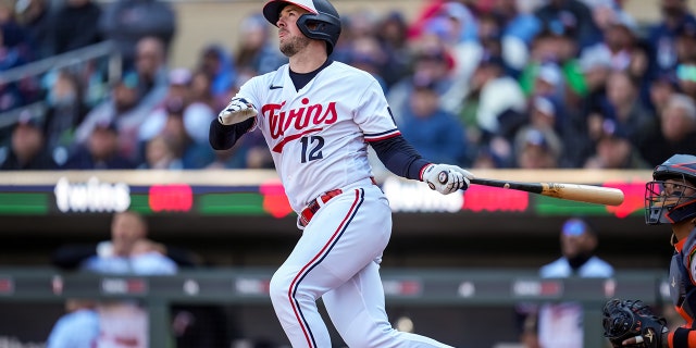 Kyle Farmer of the Minnesota Twins bats against the Houston Astros April 7, 2023, at Target Field in Minneapolis.