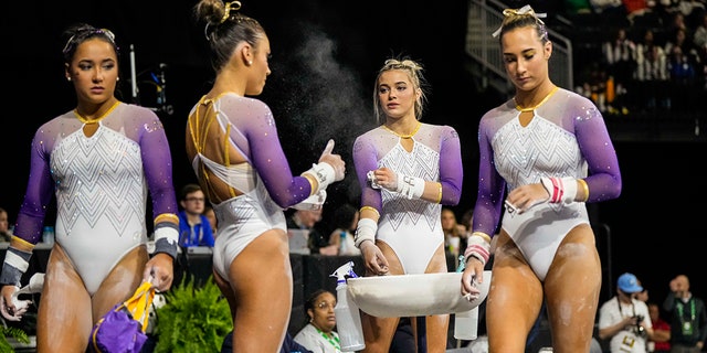 LSU Tigers gymnast Olivia Dunne, middle right, shown with teammates during the SEC Gymnastics Championship at Gas South Arena in Duluth, Georgia, March 18, 2023.