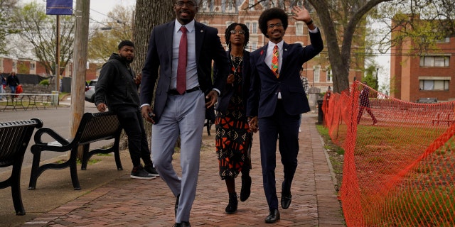 Representative Justin Pearson makes a finger sign as he arrives to attend a speech by US Vice President Kamala Harris after voting to impeach two Democrats, Justin Pearson and Justin Jones, for their roles in a gun control rally in Tennessee. Capitol, in Nashville, Tennessee, USA, April 7, 2023.