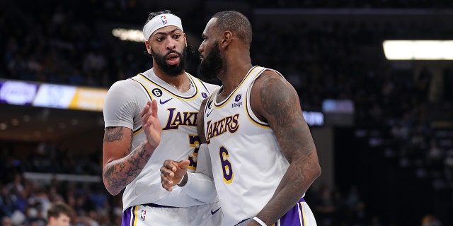 Anthony Davis #3 of the Los Angeles Lakers and LeBron James #6 of the Los Angeles Lakers during the first half against the Memphis Grizzlies during Game One of the Western Conference First Round Playoffs at FedExForum on April 16, 2023 in Memphis, Tennessee.