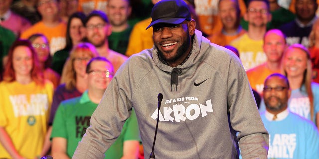 Surrounded by students and community partners, LeBron James talks about the creation of the I Promise School during an LeBron James Family Foundation event on Tuesday, April 11, 2017 at the East End Goodyear Theater in Akron, Ohio.