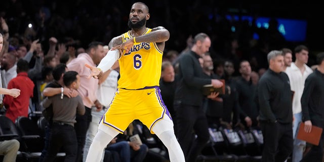 Lakers forward LeBron James celebrates after a 3-pointer by Dennis Schroder against the Minnesota Timberwolves on Tuesday, April 11, 2023, in Los Angeles.