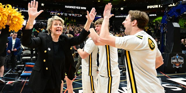 Lisa Bluder, head coach of the Iowa Hawkeyes, celebrates their victory over the South Carolina Gamecocks in the NCAA Tournament Final Four at American Airlines Center on March 31, 2023 in Dallas, Texas.