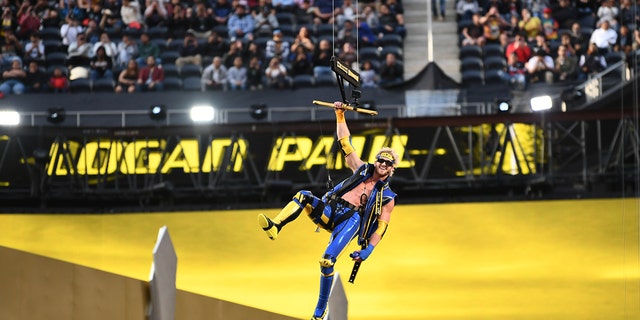 Logan Paul flies into the ring on a zipline