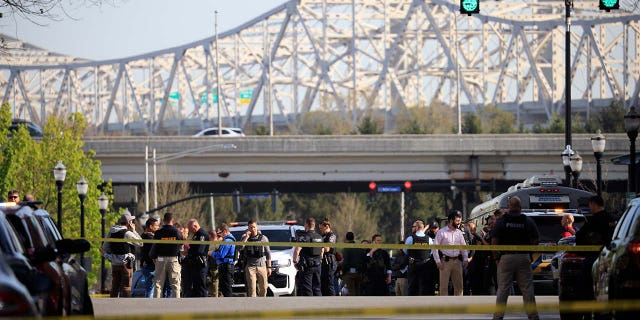 Law enforcement officers respond to an active shooter near the Old National Bank building on April 10, 2023 in Louisville, Kentucky. According to initial reports, there are multiple casualties but the shooter is no longer a threat.