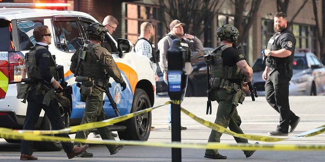 Police deploy at the scene of a mass shooting near Slugger Field baseball stadium in downtown Louisville, Kentucky, U.S. April, 10, 2023.  