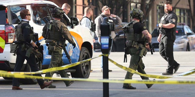 Police deploy at the scene of a mass shooting near Slugger Field baseball stadium in downtown Louisville, Kentucky, on April, 10, 2023.  