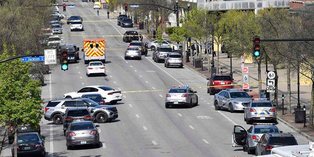 Police and other emergency personnel block off the street outside the Old National Bank building in Louisville, Monday, April 10, 2023.