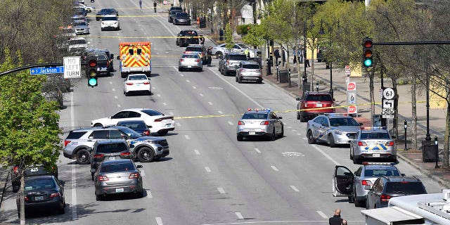 Police and other emergency personnel block off the street outside the Old National Bank building in Louisville, Monday, April 10, 2023.