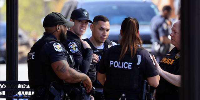 Law enforcement officers respond to an active shooter at the Old National Bank building on April 10, 2023, in Louisville, Kentucky.