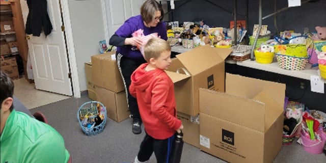 Luke Flerlage, 6, started volunteering with his parents in 2020, has been back every year, bringing in more and more supplies for the Easter Baskets.