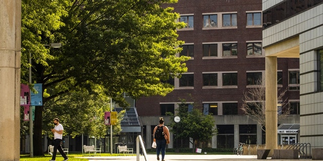People walk through the Massachusetts Institute of Technology campus in Cambridge, Massachusetts, on June 2, 2021.