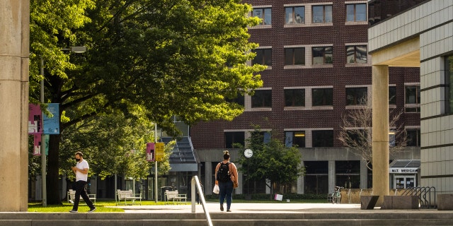 People walk through the Massachusetts Institute of Technology campus in Cambridge, Massachusetts, on June 2, 2021.