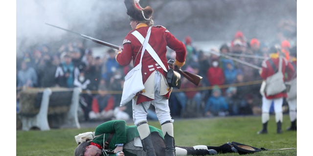 Lexington Minuteman Jonas Parker was shot, then killed by bayonet after vowing never to run from the British. A reenactor lays dead after being bayonetted by one of His Majesty's Regulars, one of the first casualties of the Battle of Lexington Green. The Battle of Lexington is commemorated on Patriots' Day; the town pays tribute to those who died on April 19, 1775.
