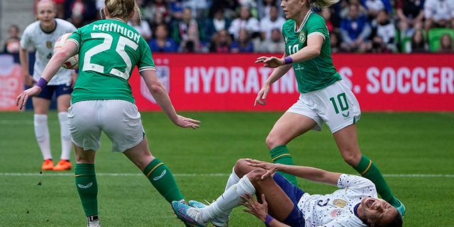 United States forward Mallory Swanson (9) goes down with an injury during the first half of an international friendly soccer match against Ireland in Austin, Texas, Saturday, April 8, 2023. 