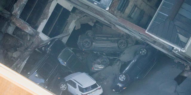 Cars are seen piled up after the collapse of a parking garage in the Manhattan borough of New York City, U.S., April 18, 2023.  