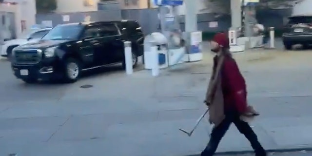 A video shared to the Citizen App shows a man carrying a metal object in the area of the attack in San Francisco's Marina District on Wednesday. Police have not confirmed whether he was involved in the attack nearby, where former Fire Commissioner Don Carmignani was beaten with a knife and a pipe by a "group of homeless people," according to friends.