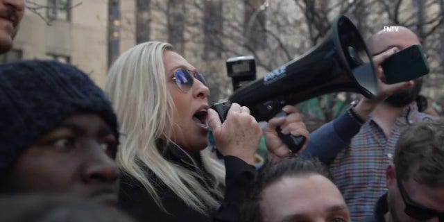 Marjorie Taylor Greene sends message to Eric Adams with bullhorn in hand ahead of Trumps arraignment.