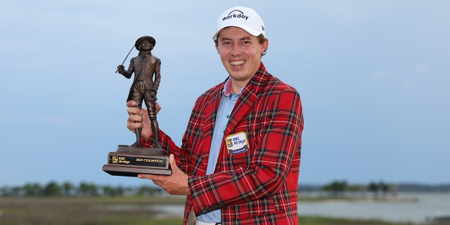 Matt Fitzpatrick of England celebrates with the trophy in the Heritage Plaid Tartan Jacket after winning the playoff during the final round of the RBC Heritage at Harbor Town Golf Links on April 16, 2023 in Hilton Head Island, South Carolina.