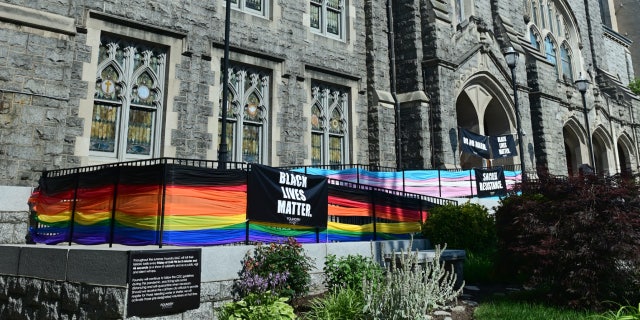 The exterior of Foundry United Methodist Church with colors of the Pride and Progress flags June 25, 2020, in Washington, D.C.