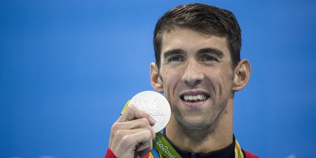 Michael Phelps with his medal