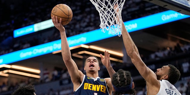 Michael Porter Jr drives to the basket