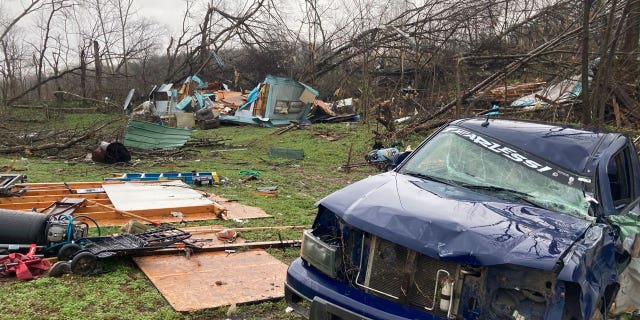 The remains of a mobile home that was torn apart by a tornado cover the ground in Glen Allen, Missori, on April 5, 2023.