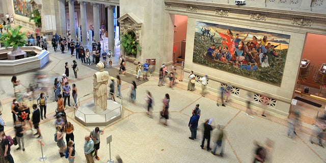 FILE: People roam around the entrance on reopening day at The Metropolitan Museum of Art (The Met), Aug. 29, 2020, in New York City. 