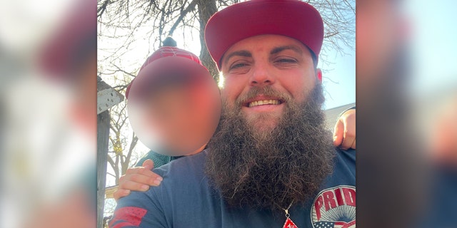Oklahoma City shooting suspect Tyler Myers wears a "1%er" pendant in a Facebook photo. He was one of six people shot in a biker gang-related shoot-out over the weekend, according to authorities, and faces a charge of first-degree murder for his alleged role in the incident.