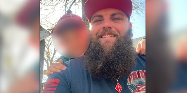 Oklahoma City shooting suspect Tyler Myers wears a "1%er" pendant in a Facebook photo. He was one of six people shot in a biker gang-related shoot-out over the weekend, according to authorities, and faces a charge of first-degree murder for his alleged role in the incident.