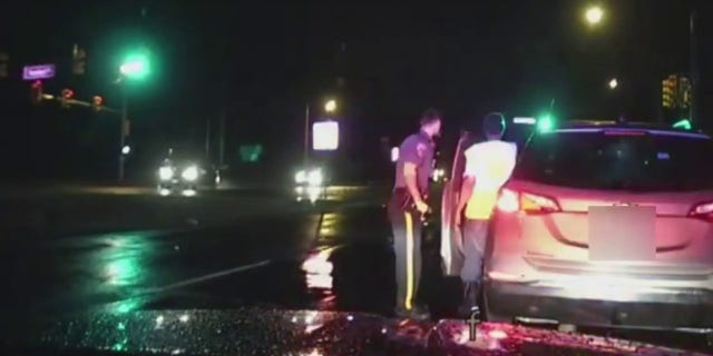 police officer helping driver