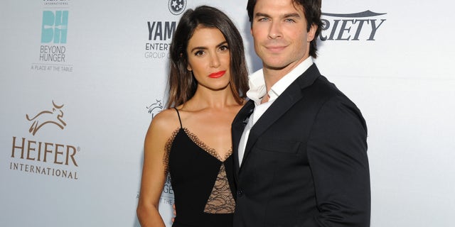 Nikki Reed poses with her husband Ian Somerhalder