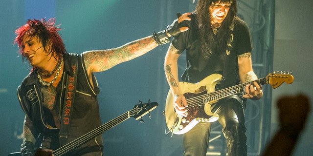 Nikki Sixx and Mick Mars of Mötley Crüe perform on July 15, 1999, in New York City.