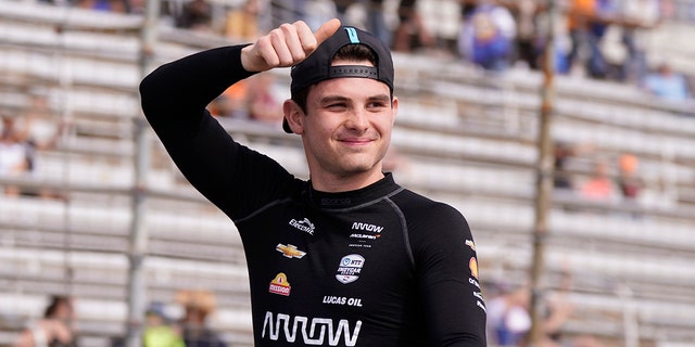Pato O'Ward of Mexico waves during introductions for the IndyCar race at Texas Motor Speedway in Fort Worth, Texas on Sunday, April 2, 2023. 