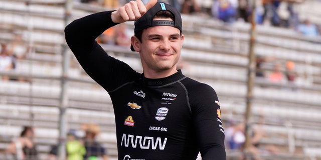 Pato O'Ward of Mexico waves during introductions for the IndyCar race at Texas Motor Speedway in Fort Worth, Texas on Sunday, April 2, 2023.