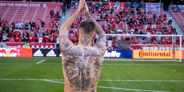 Patryk Klimala salutes fans