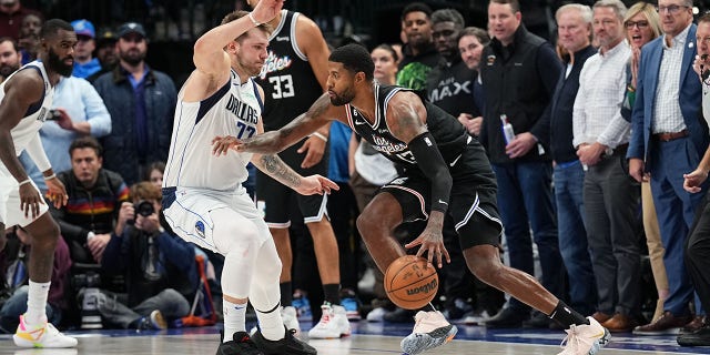 Paul George #13 of the LA Clippers drives to the basket during the game against the Dallas Mavericks on November 15, 2022, at the American Airlines Center in Dallas, Texas.