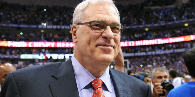 Phil Jackson walks off the court