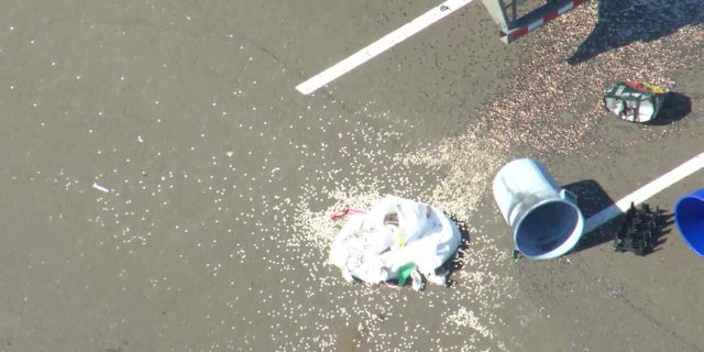 Police arrived and discovered dimes scattered across the parking lot.