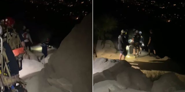 rescuers helping woman down park trail