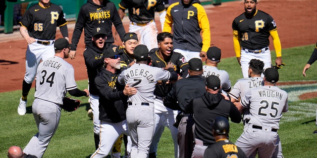 The benches clear as a result of a home plate collision between Pittsburgh Pirates' Oneil Cruz and Chicago White Sox catcher Seby Zavala during the sixth inning of a baseball game in Pittsburgh, Sunday, April 9, 2023. Cruz was injured on the play and helped off the field.