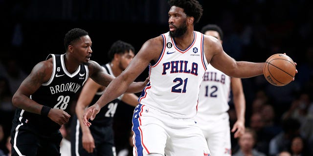 Joel Embiid dribbles during a playoff game