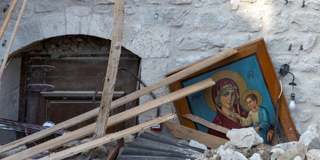 Many religious artifacts and personal items of people withstood the earthquake. An icon is seen among the remains of the destroyed Virgin Mary Greek Orthodox Church aftermath of the deadly earthquake in Tokacli Village of Altinozu in Hatay province, Turkey.