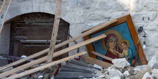 Many religious artifacts and personal items of people withstood the earthquake. An icon is seen among the remains of the destroyed Virgin Mary Greek Orthodox Church aftermath of the deadly earthquake in Tokacli Village of Altinozu in Hatay province, Turkey.