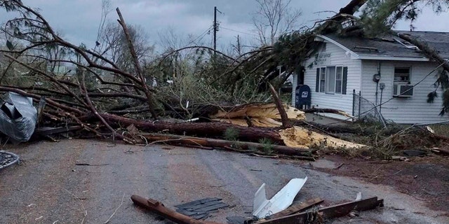 Debris covers the ground as homes are damaged after severe weather in Glen Allen, Mo., on Wednesday, April 5, 2023.