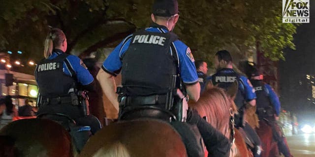 Mounted police patrolling down Rainey Street