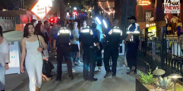 Police patrolling down Rainey Street