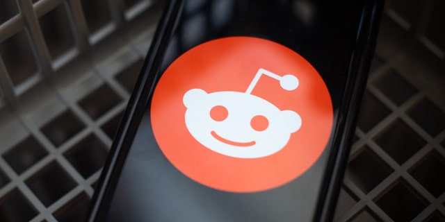 The Reddit logo on a smartphone