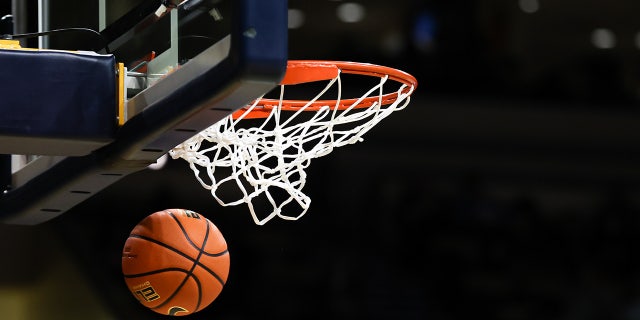 Basketball going through the hoop