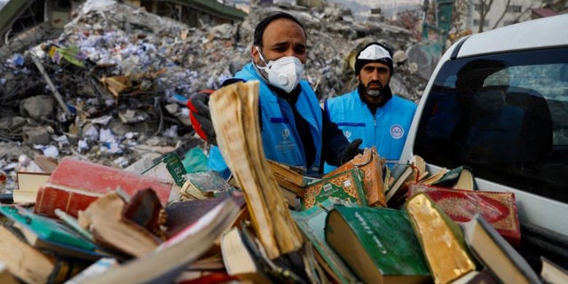 People are seen collecting copies of the Koran and Gospels from the rubble in the aftermath of a deadly earthquake in Kahramanmaras, Turkey. Many religious congregations collapsed, though religious text and symbols survived the disaster.